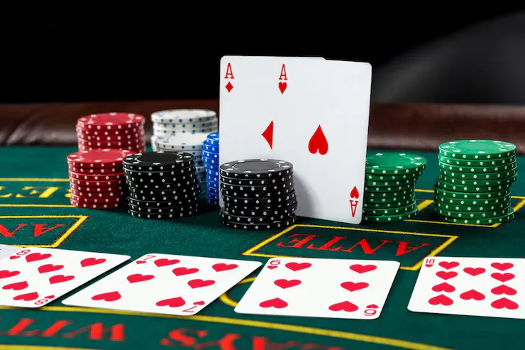 poker-play-chips-cards-green-table_639032-1474 (1)